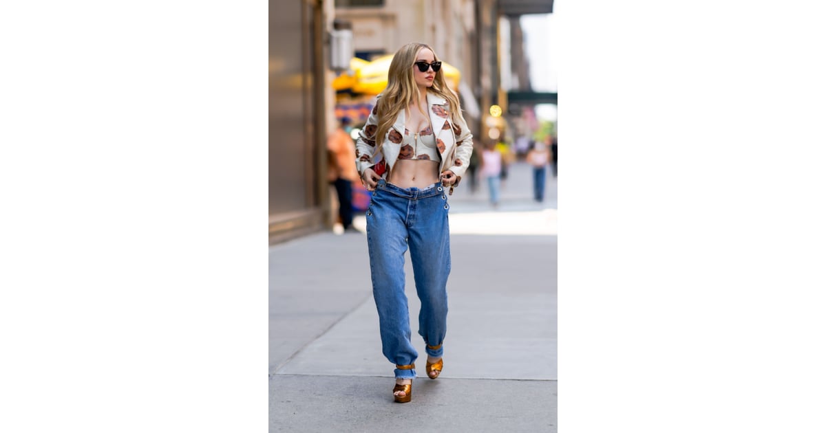 Dove Cameron Wearing Low-Rise Jeans and Moschino Top in NYC