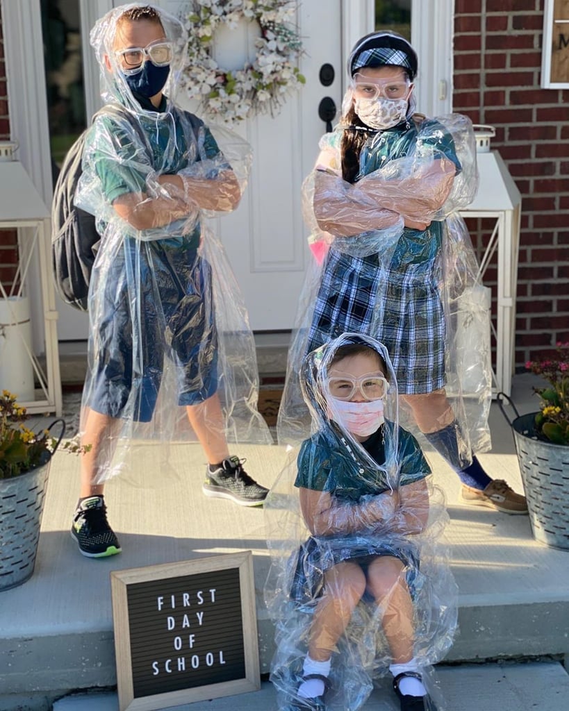 A mom named Danielle staged a light-hearted back-to-school photo amid the pandemic featuring her kids in masks and plastic ponchos. "Just a few extra safety measures for Back to School," she captioned the picture. "No additional caption needed."
