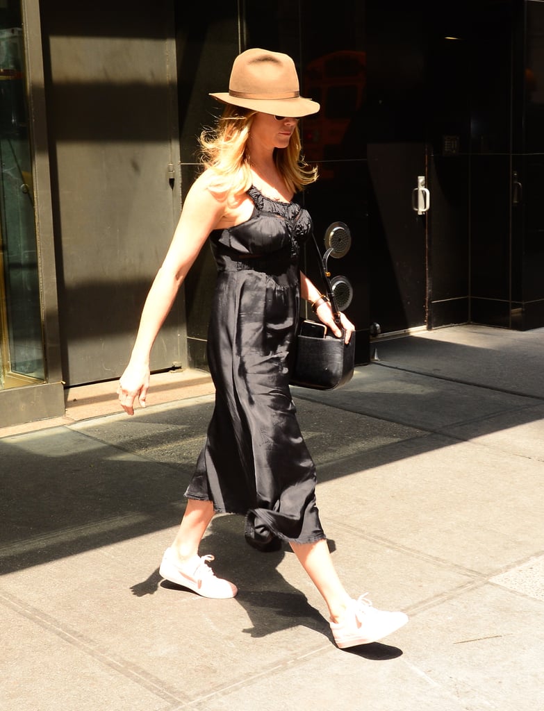 Jen styled the bag with a delicate silk dress, a felt fedora, and white sneakers in NYC in June 2016.