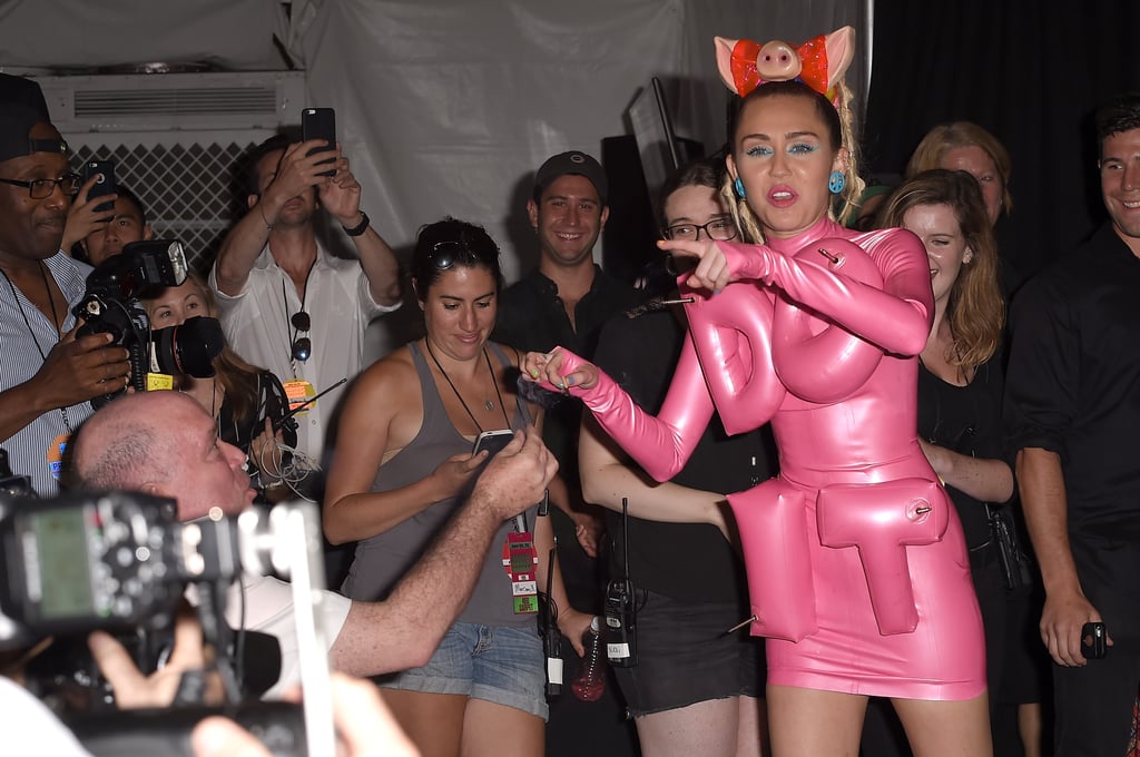 Miley Cyrus Shares a Joint With Photographers at VMAs