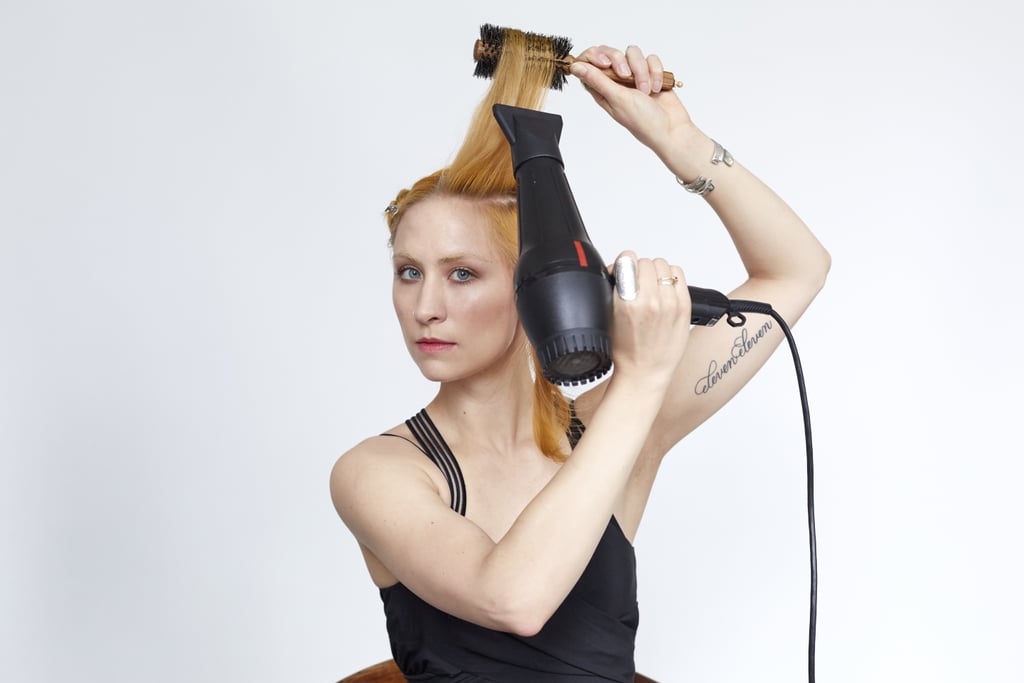 Repeat on the second half of your section. Direct hair and dryer up and away from your face for added lift and volume.