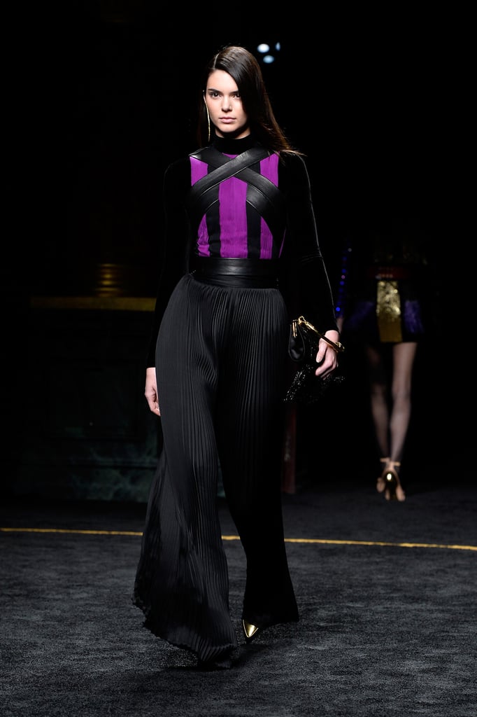Kendall went for a dark moody look in billowing black pants and a strappy top during the Fall 2015 runway show at Paris Fashion Week.