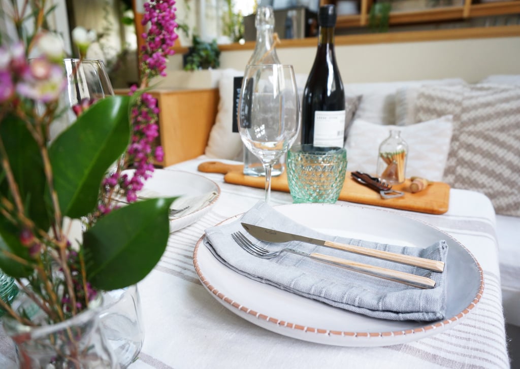 Whitney's home proves you can't judge style by square footage. Her coffee table easily doubles as an elegant dining table — perfect for entertaining — when she sets it with springtime dishes, flatware, and flowers. Whitney's home proves you can't judge style by square footage. Her coffee table easily doubles as an elegant dining table — perfect for entertaining — when she sets it with springtime dishes, flatware, and flowers.