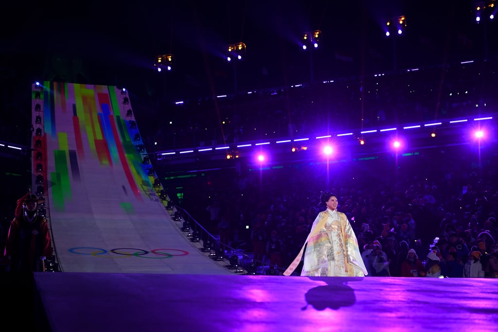 Sumi Hwang performs the Olympic Anthem.