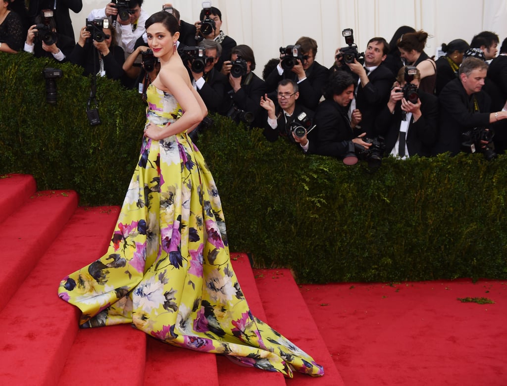 Emmy Rossum climbed the stairs in her floral gown.