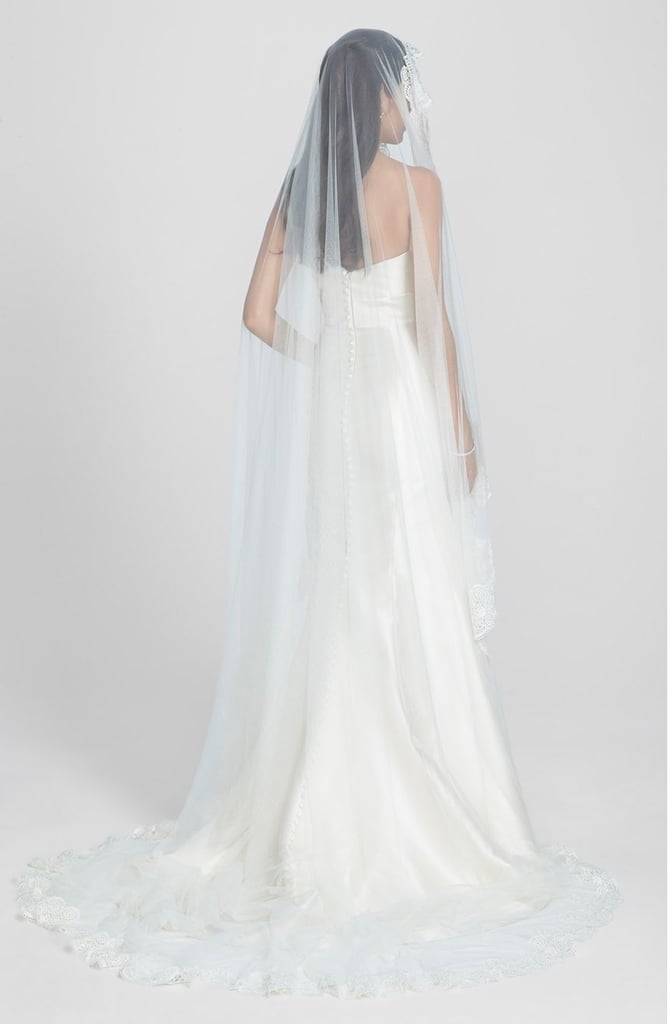 A scalloped lace boarder gives this mantilla veil ($598) a traditional and classic look.