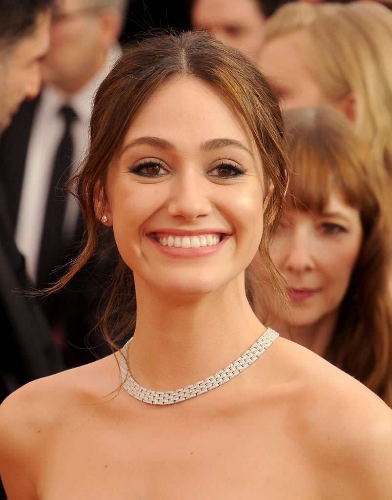 Emmy Rossum's strapless dress gave way to a delicate Cartier choker.