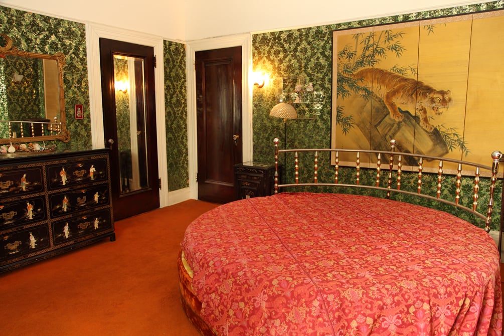 This bedroom is so dated and unique that we kinda love it. (But certainly won't blame Williams for tossing that round bed!)