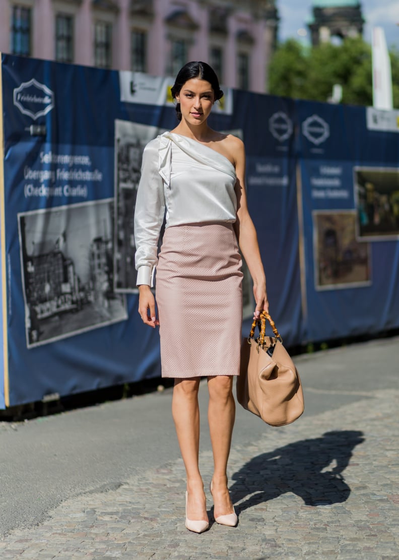 A one-shoulder blouse with a pencil skirt