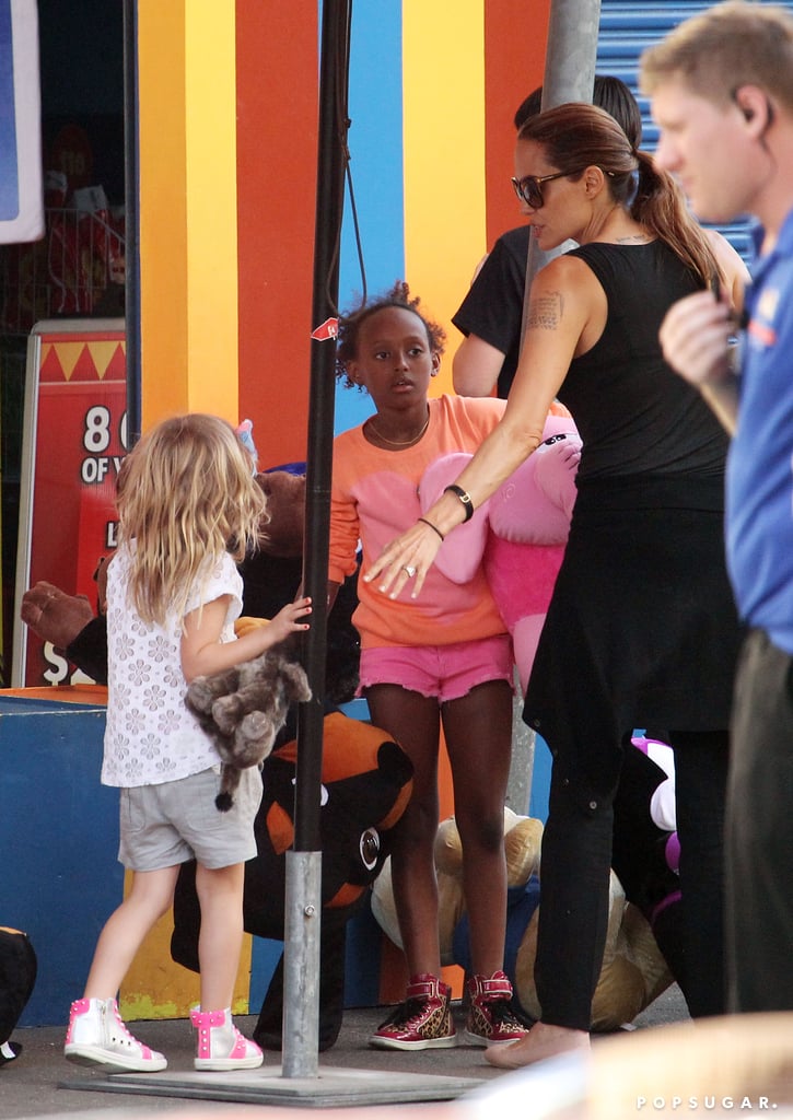Angelina ushered her children through the park.