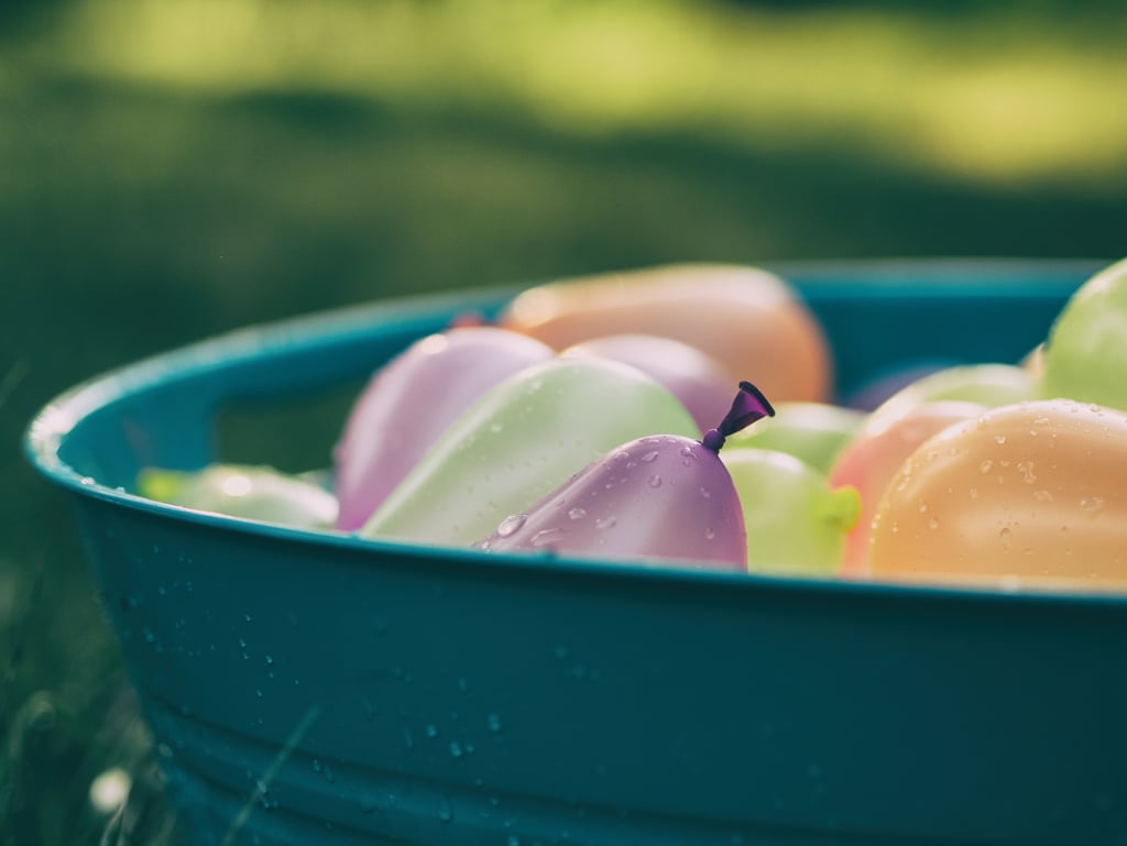 Participate in a water balloon fight. Participate in a water balloon fight.