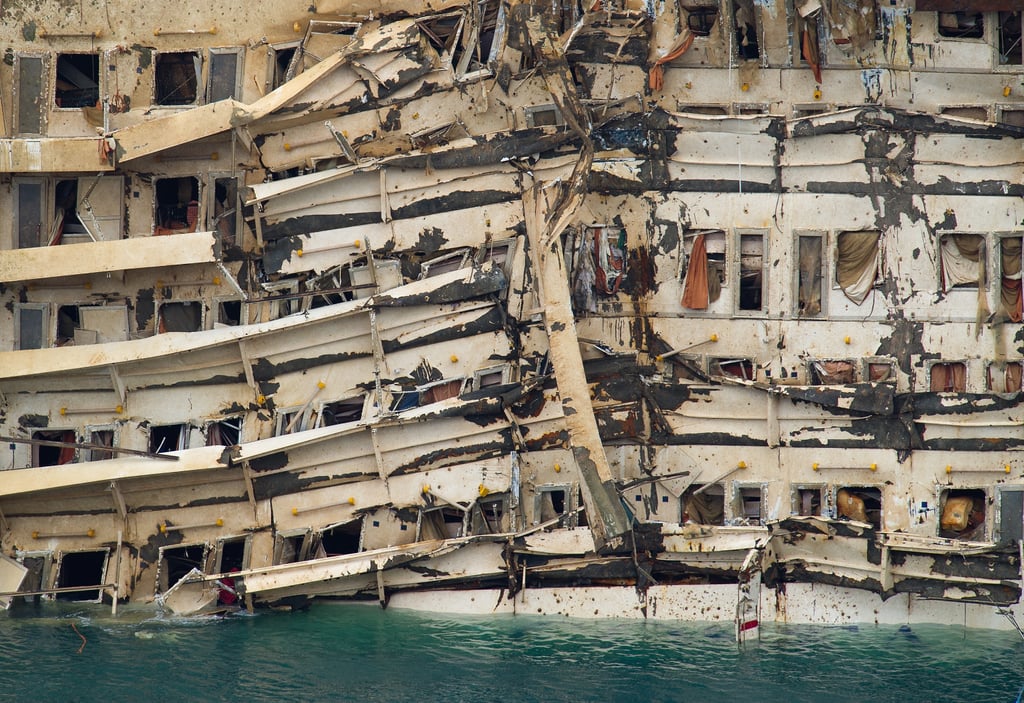 The parbuckling operation shifted the vessel upright, revealing severe damage.