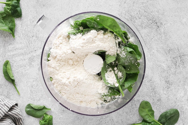 Spinach and flour in a food processor