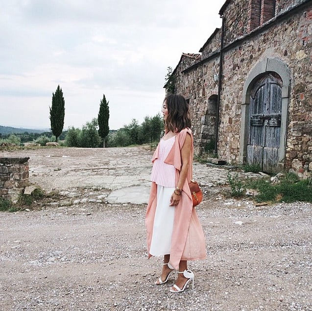 Aimee Song provides this photo with all the color it needs. Wearing pink pastel separates, she looks romantic in a decidedly abandoned yet totally beautiful setting.