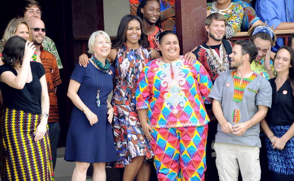 While posing with members of the Peace Corps, Michelle was a standout in the design.