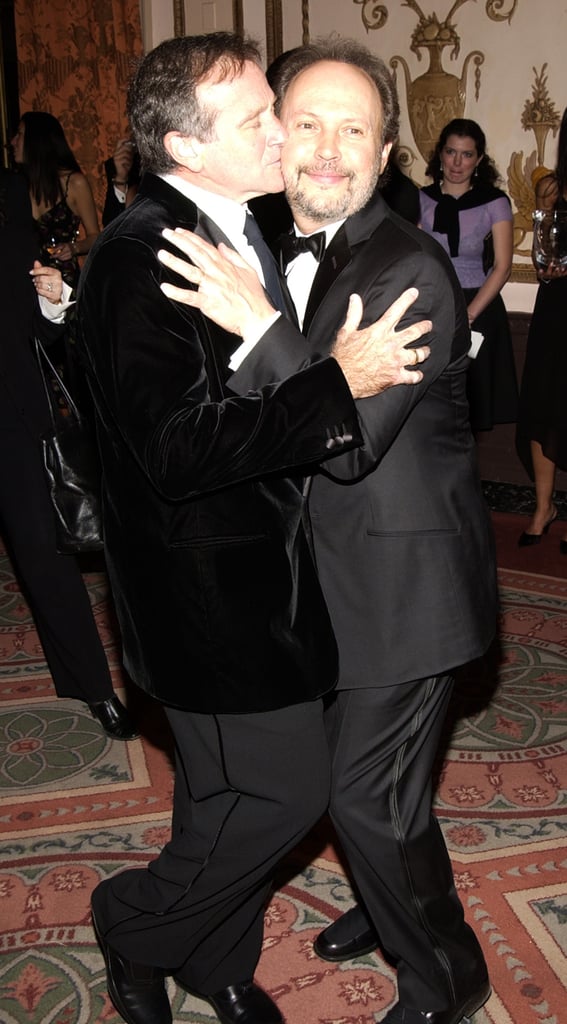 Robin gave pal Billy Crystal a smooch at NYC's American Museum of the Moving Image where Billy was awarded in February 2003.