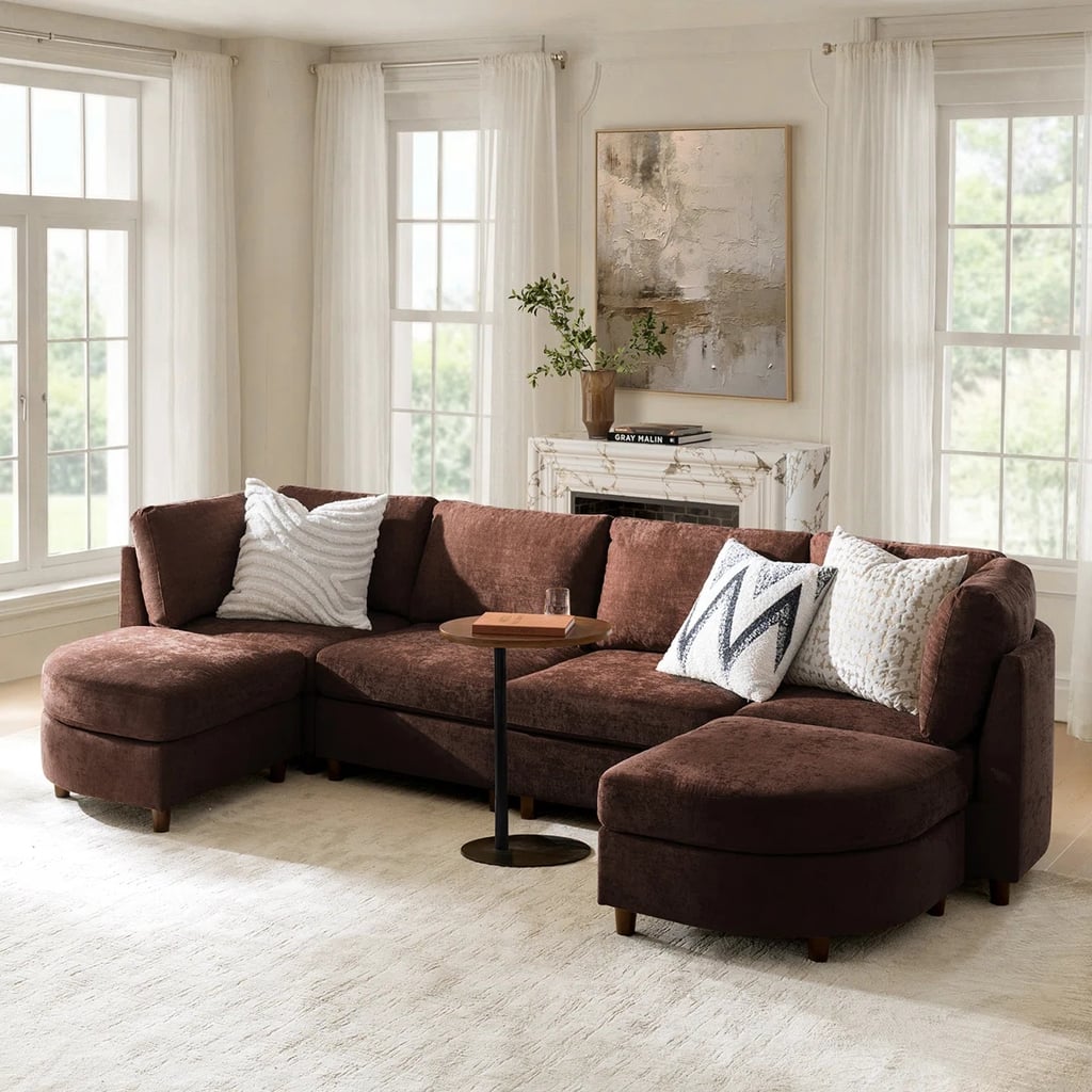 Hokku Designs Dayman 125" W Storage Sectional with Ottoman ($1,390, originally $3,550)
From the buttery-soft fabric to the chic curved ottomans, this sectional perfectly marries luxury and comfort. Classified as a slightly more high-end offering, this Hokku Designs piece sits up to six people in a symmetrical layout. Any of the seven colorways will instantly elevate your space while maintaining an inviting feel.  What we love:

Thanks to the elevated legs, you can seamlessly store items under the couch.

Who it's best for:

The two ottomans are moveable, so you can constantly adjust the seating format based on the flow of the room or event.

Who should avoid it:

The foam and spring cushion lets you sink into each seat, which might be too soft for those who prefer a firmer feel.

The Details: Width: 125" | Height: 34.5" | Depth: 33.75" | Upholstery: Chenille | Color Options: 7