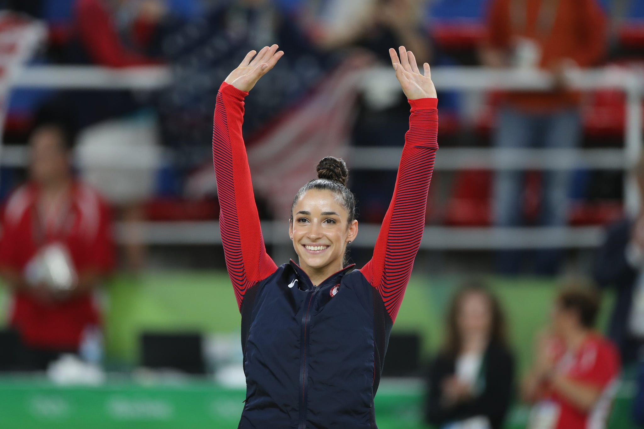 Gymnastics - Olympics: Day 6  Alexandra Raisman #395 of the United States waves to the crowd on the podium before receiving her silver medal during the Artistic Gymnastics Women's Individual All-Around Final at the Rio Olympic Arena on August 11, 2016 in Rio de Janeiro, Brazil. (Photo by Tim Clayton/Corbis via Getty Images)