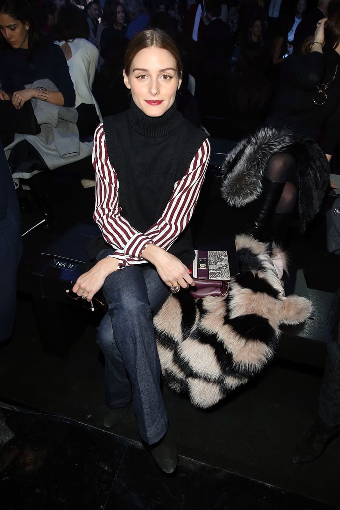 Olivia proved that she is a layering pro when she arrived at the Elie Saab show wearing a sheer striped shirt underneath a sleeveless black turtleneck.