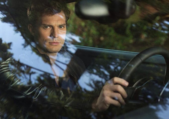 Jamie Dornan as Christian Grey.