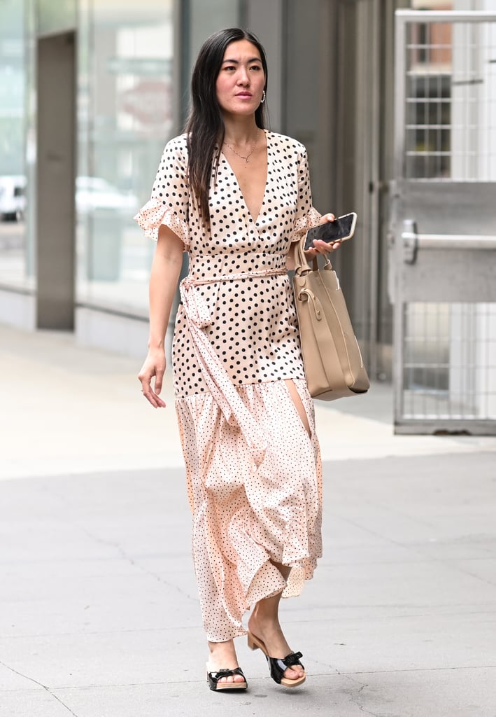 Keep all eyes on the print of your maxi dress by opting for a simple tote and wooden sandal.