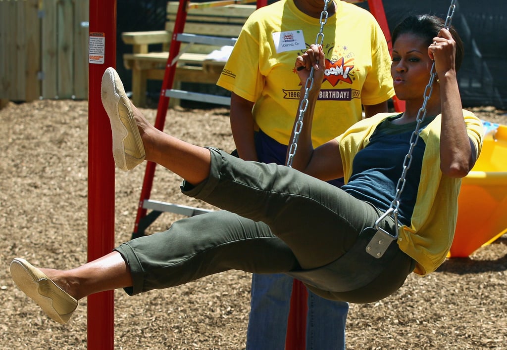 Swinging on a playground she helped build in 2011.