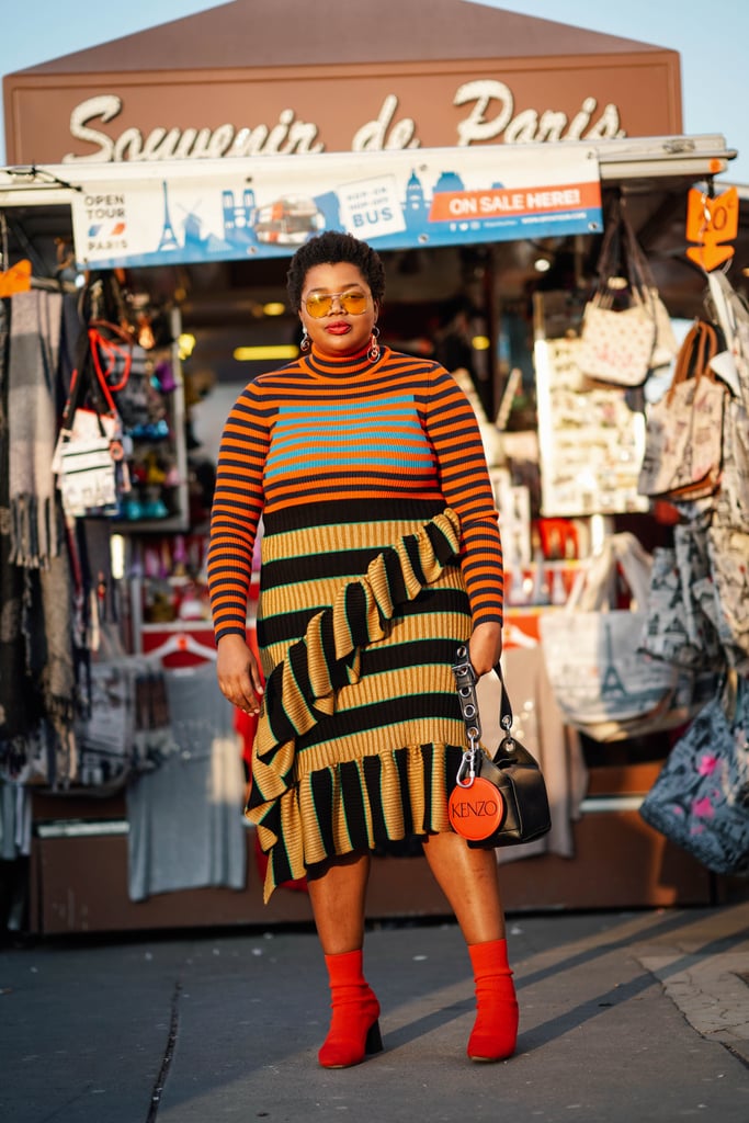 A striped top is a bold base layer for a multicolored slip dress.