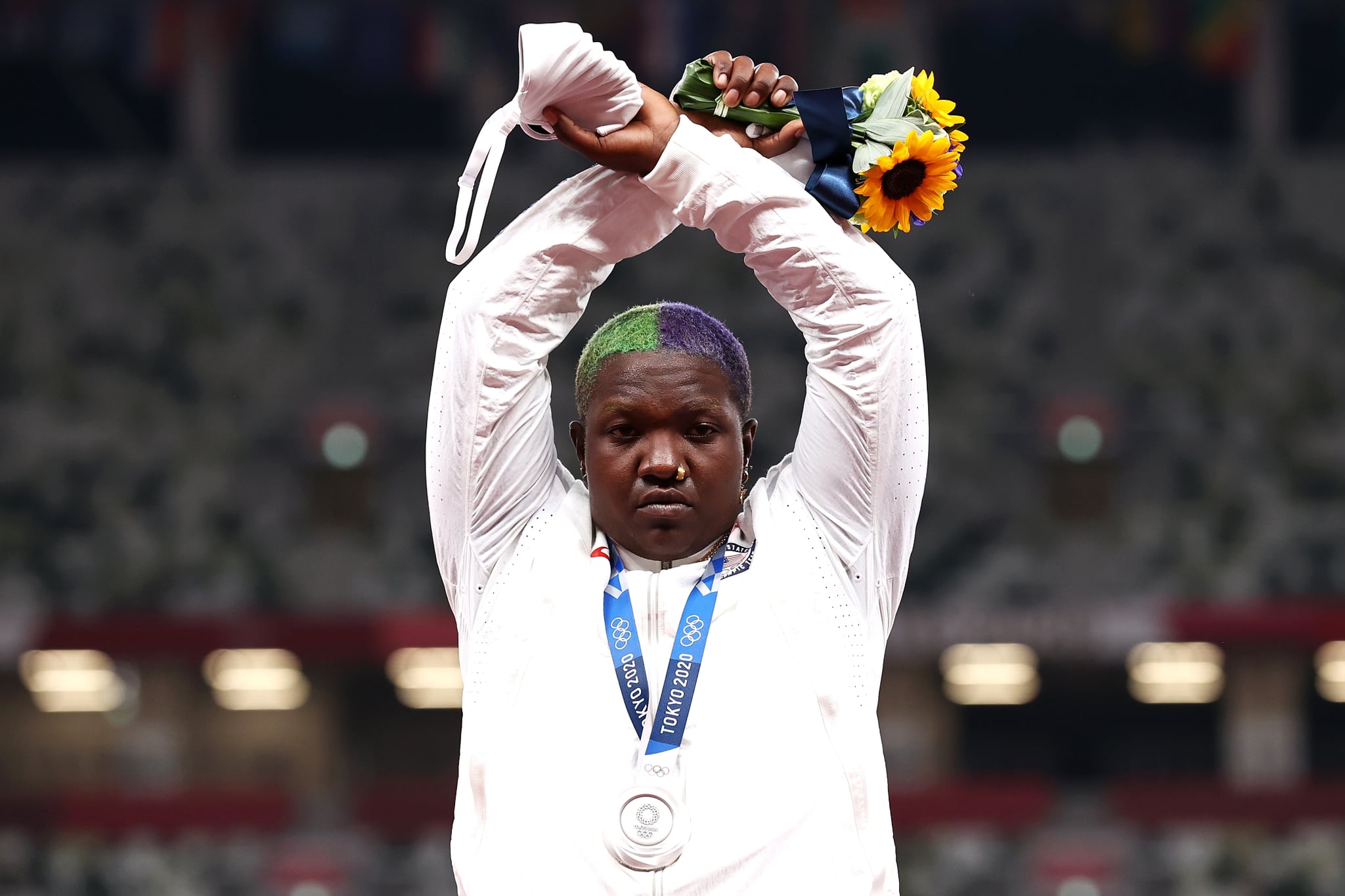 TOKYO, JAPAN - AUGUST 01: Raven Saunders of Team United States makes an 'X' gesture during the medal ceremony for the Women's Shot Put on day nine of the Tokyo 2020 Olympic Games at Olympic Stadium on August 01, 2021 in Tokyo, Japan. (Photo by Ryan Pierse/Getty Images)