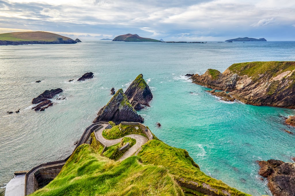 While in Dingle, make sure you check out Conor Pass, Slea Head Drive (which is part of the Wild Atlantic Way), Dunquin Pier (pictured), and Inch Beach. And if the weather permits, go surfing or kayaking on Dingle's beautiful blue waters. 
For food, definitely grab ice cream from Murphy's, enjoy fresh seafood at Out of the Blue, grab your morning coffee from Bean in Dingle, and enjoy a few pints of Guinness or cider at Dick Macks or Foxy John's.