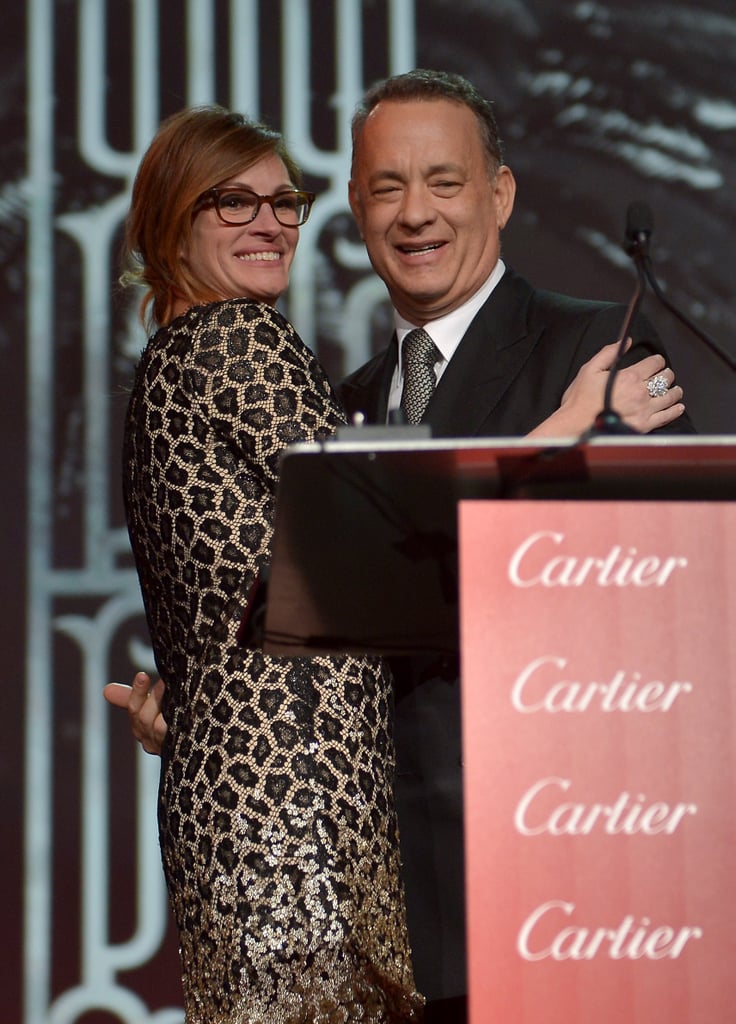 Julia Roberts presented Tom Hanks, her friend and former costar, with his chairman's award at the Palm Springs Film Festival.