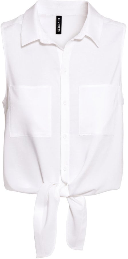 Ditch a traditional crop top for a tie blouse instead. It shows a hint of skin but feels less deliberate than its shrunken sister.
Sleeveless Tie Blouse  ($18)