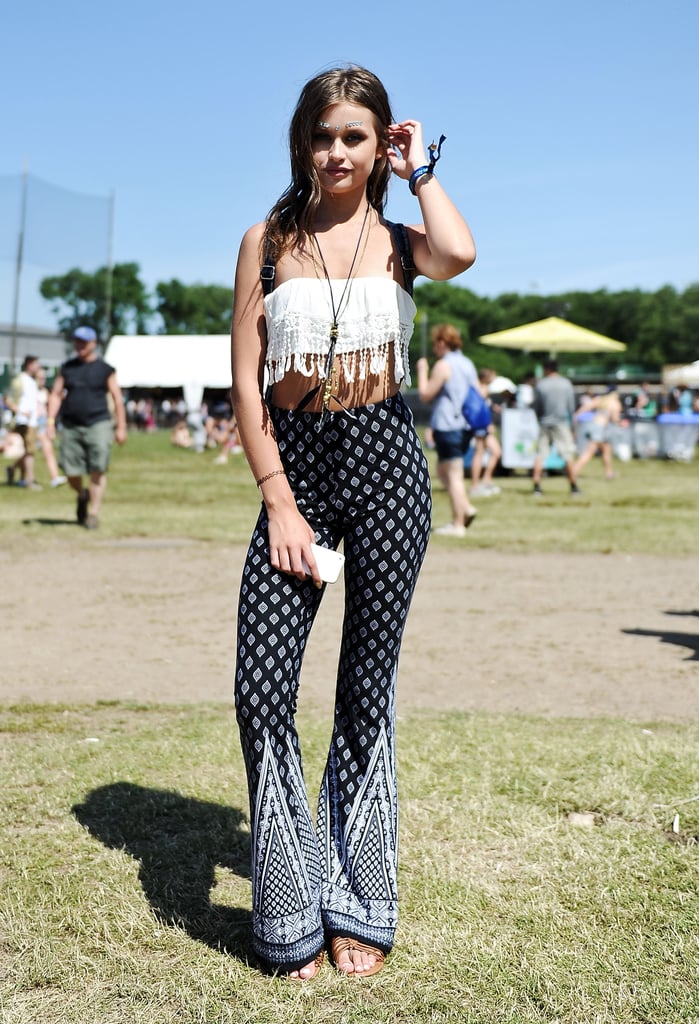 A fringe crop top and flared paisley pants fit in with the weekend's bohemian vibes.