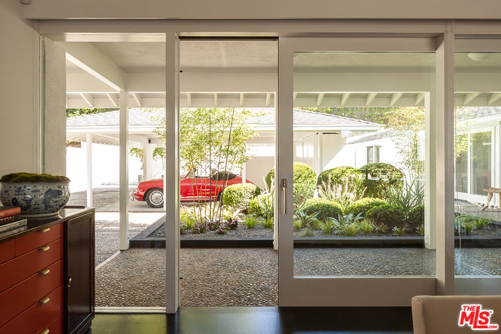 This home is made for the indoor-outdoor lifestyle, with glass doors providing direct access to the backyard from every room.