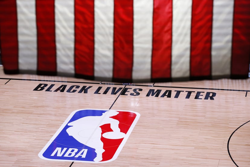 LAKE BUENA VISTA, FLORIDA - AUGUST 26: An empty court and bench is shown following the scheduled start time in Game Five of the Eastern Conference First Round between the Milwaukee Bucks and the Orlando Magic during the 2020 NBA Playoffs at AdventHealth A