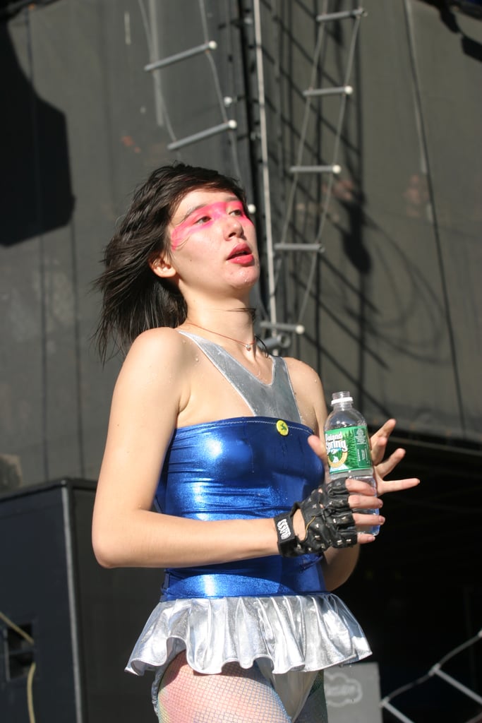 In 2004 wearing a silver and blue ruffled bodysuit.