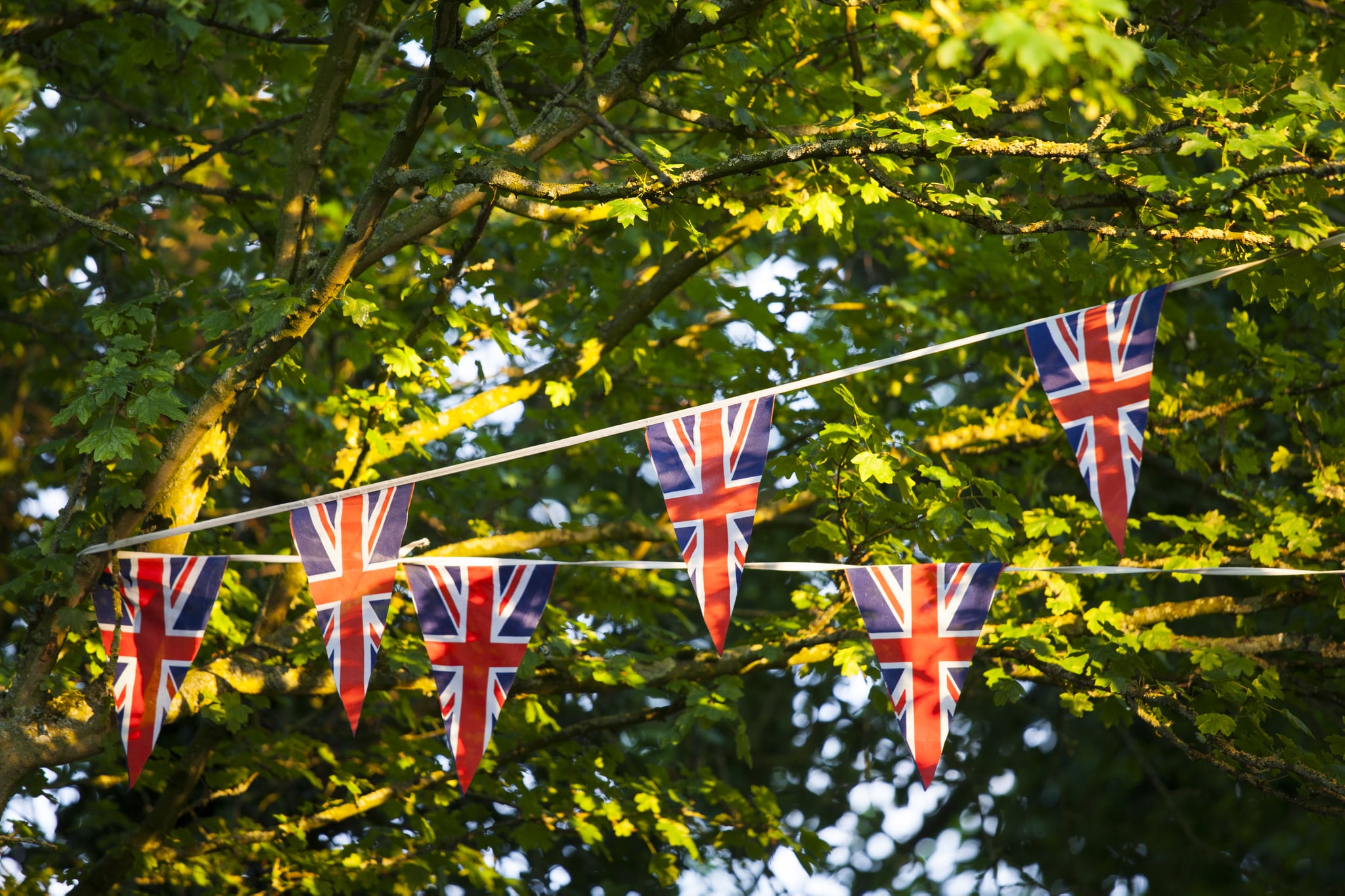 UNITED KINGDOM - JUNE 04:  Union Jack flag bunting at street party to celebrate the Queen's Diamond Jubilee in Swinbrook in the Cotswolds, UK  (Photo by Tim Graham/Getty Images)