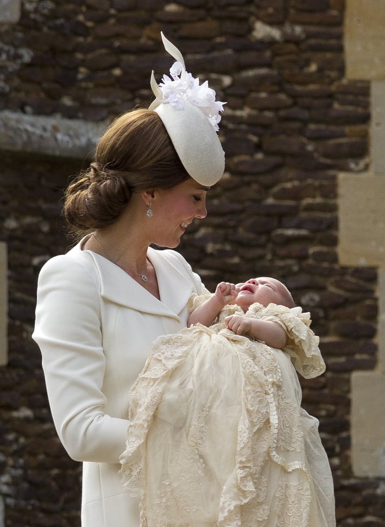 Kate couldn't help but smile widely at Charlotte on the day of her christening.