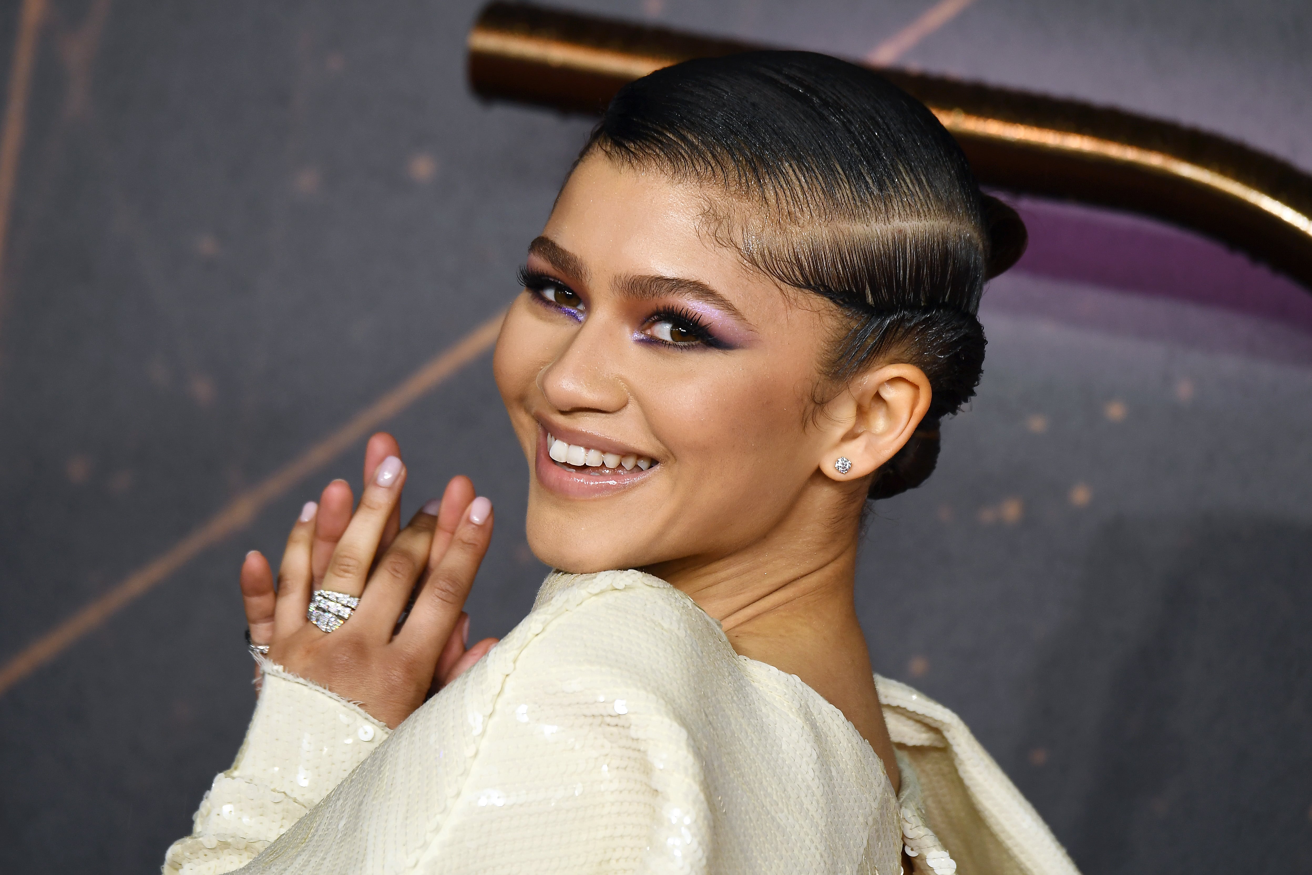 zendaya purple dress dune Zendaya Attends the 'Dune' Premiere in Paris Wearing Alaia Spring 2022 Long  Sleeve Crop Top and Maxi Skirt
