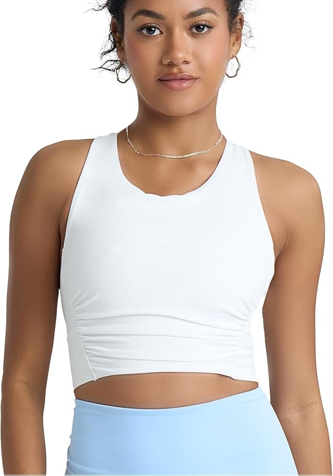 PS Shirred Criss Cross Longline Sports Bra Yoga Top ($20, originally $25)
Consider adding this longline yoga top to your rotation, right from our collection on Amazon. It's available in four other colors and comes with a built-in bra with removable cups and criss-cross back straps to ensure comfort and style.
Editor Quote: "As someone who typically works out in sports bras, I'm pleasantly surprised by how much I love this longline tank. The shirred seams give it a noticeably flattering fit and the crisscross back makes me feel secure, even though the top itself isn't too tight or restricting. It's functional and movable no matter what activity I'm doing, but I find it particularly appropriate for cycling on my Peloton bike at home or attending Pilates classes teamed with flared leggings. It also washes really well and stays in optimal condition when I throw it in the laundry on cold in a delicate cycle, hanging to dry." — Sarah Wasilak, shopping director