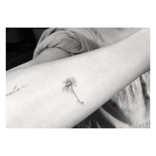 Dakota Johnson's Daisy Forearm Tattoo