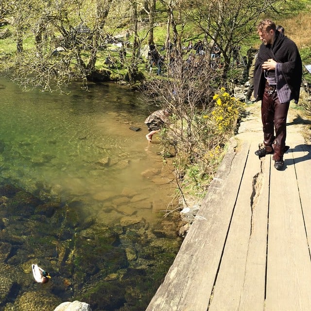 Here's Hunnam, just hanging out by a pond.