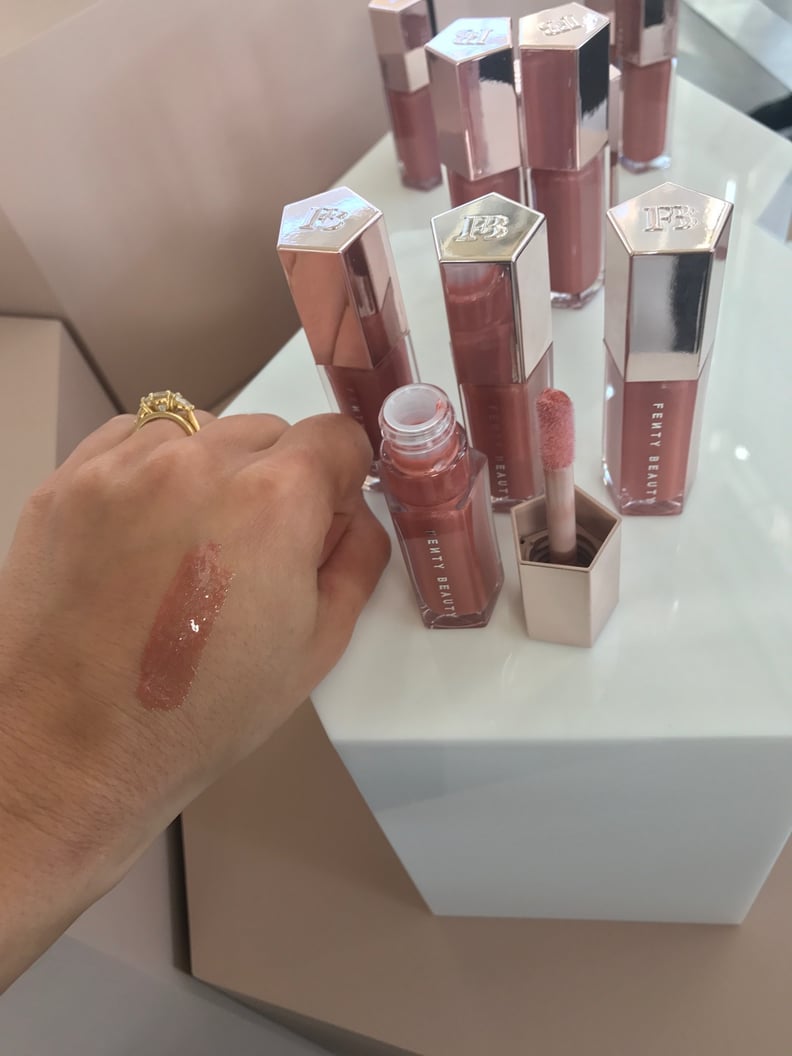 Fenty Beauty by Rihanna Gloss Bomb Universal Lip Luminizer Swatched on a Medium Skin Tone