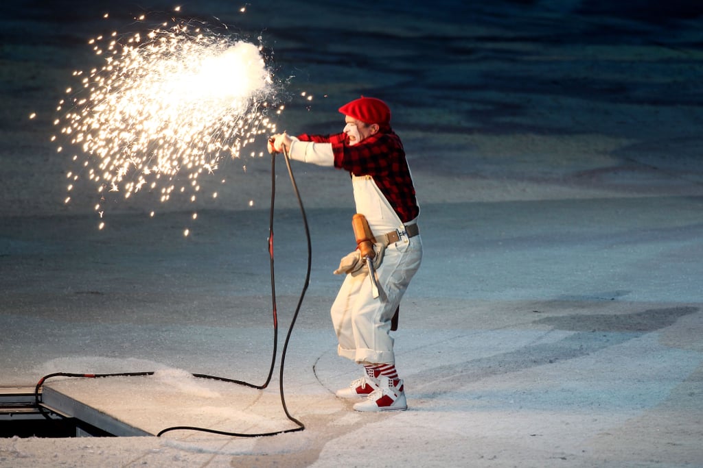 A mime performed before the Olympic cauldron was lit.