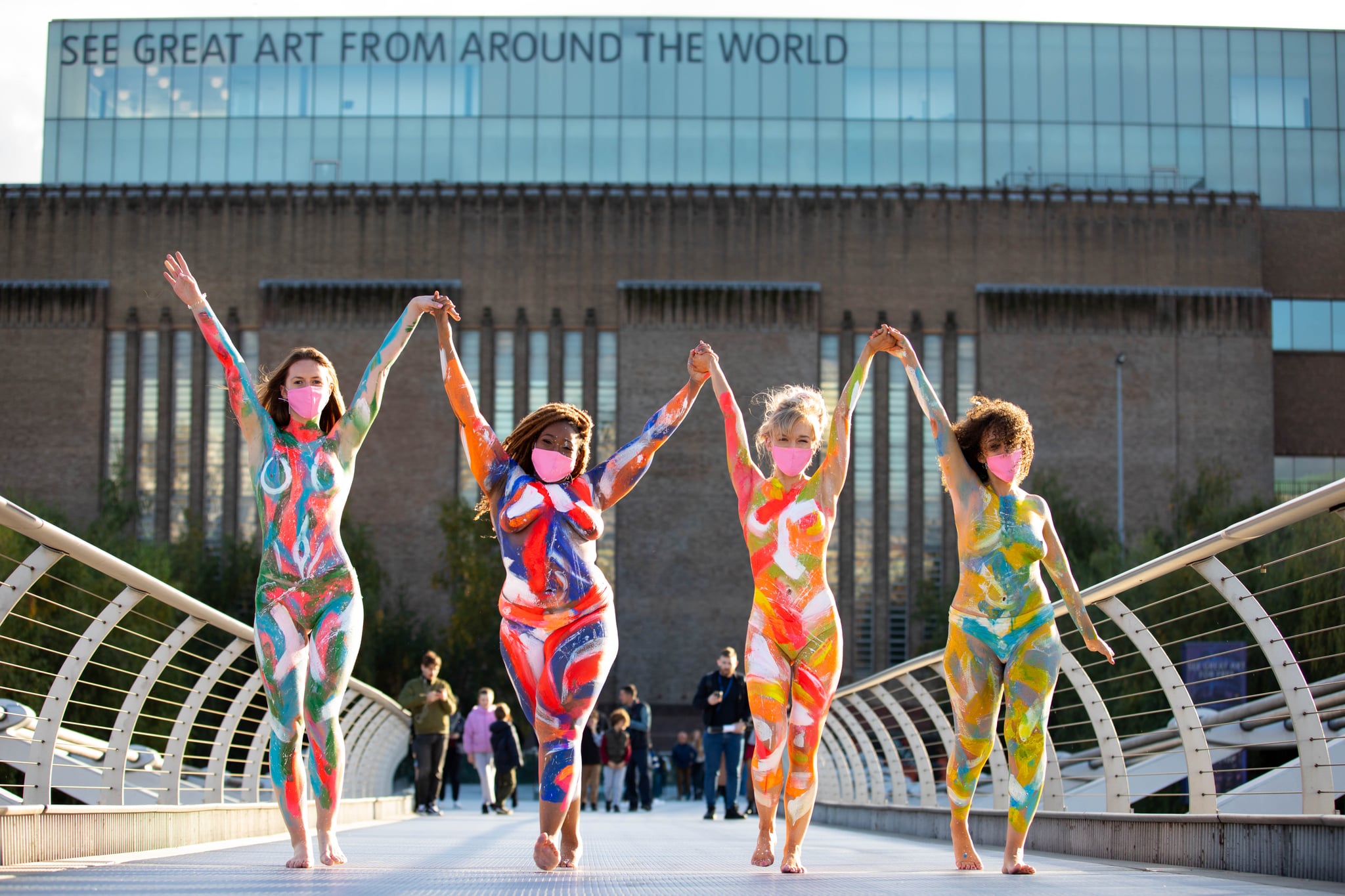 16 brave members of the public brave the cold to give Londoners a private (parts) preview of artist Sophie Tea's newest 'NUDES' collection. The 16 body confident, diverse 'NUDIES' left little to the imagination as they strolled in unity around London's landmarks - wearing just Sophie's latest designs painted onto their bodies.Credit: David Parry