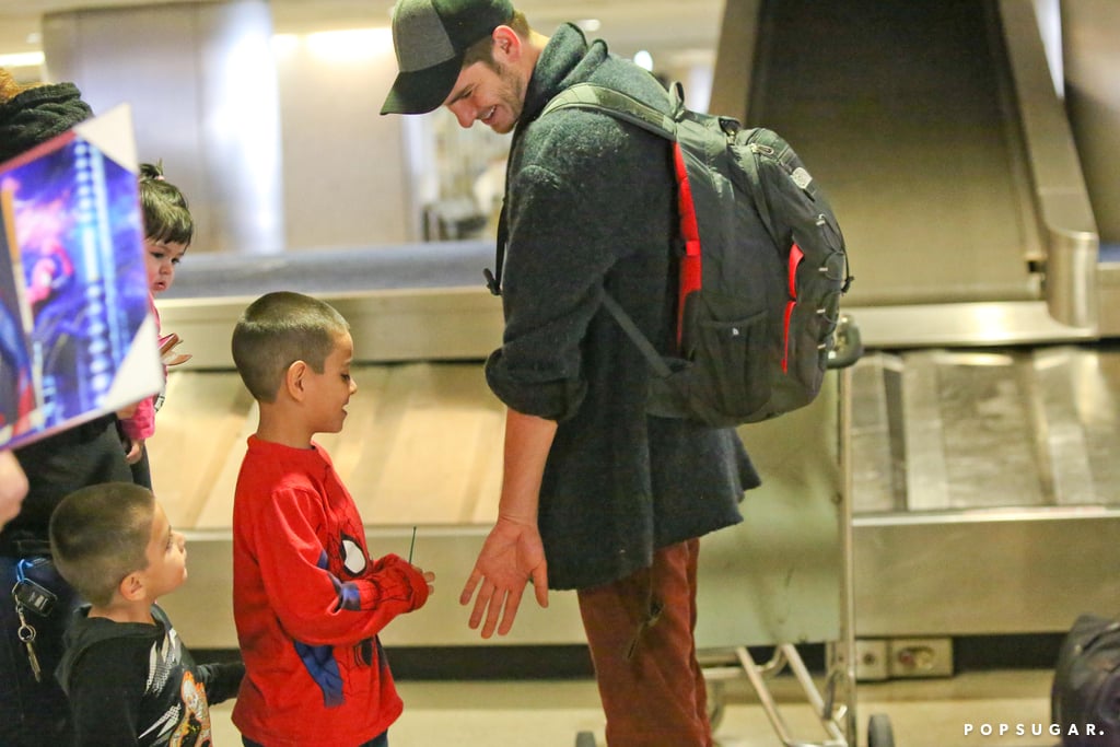 Andrew Garfield melted everyone's hearts when he greeted a tiny Spider-Man fan at the airport.