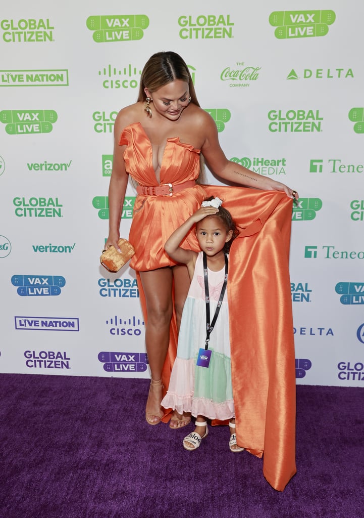 See Chrissy Teigen's Orange Dress at Global Citizen Vax Live