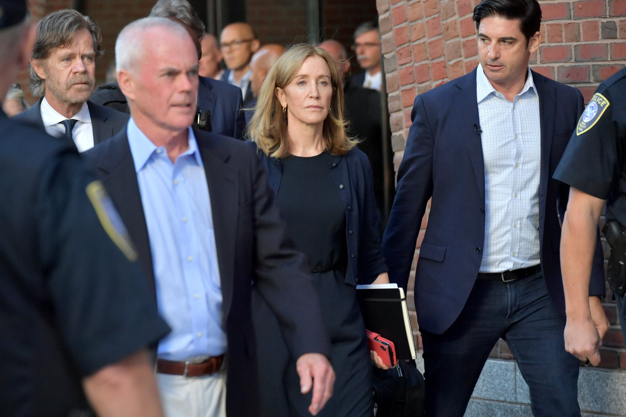 BOSTON, MA - SEPTEMBER 13:  Felicity Huffman and husband William Macy exit John Moakley U.S. Courthouse where Huffman received a 14 day sentence for her role in the college admissions scandal on September 13, 2019 in Boston, Massachusetts.  (Photo by Paul Marotta/Getty Images)