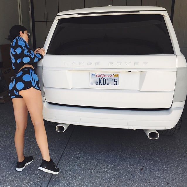 Kylie uploaded the above photo to Instagram with the caption, "Ridin round town in the big ol' rangeeee. Thanks @adidasoriginals for the cute sets."