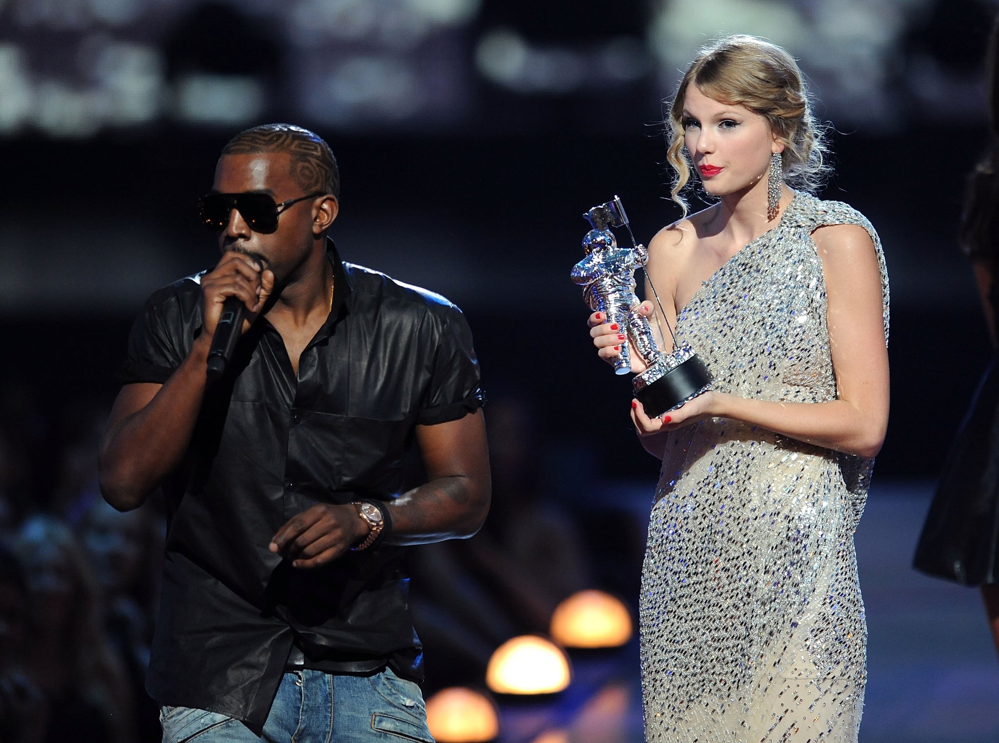 NEW YORK - SEPTEMBER 13:  Kanye West takes the microphone from Taylor Swift and speaks onstage during the 2009 MTV Video Music Awards at Radio City Music Hall on September 13, 2009 in New York City.  (Photo by Kevin Mazur/WireImage)