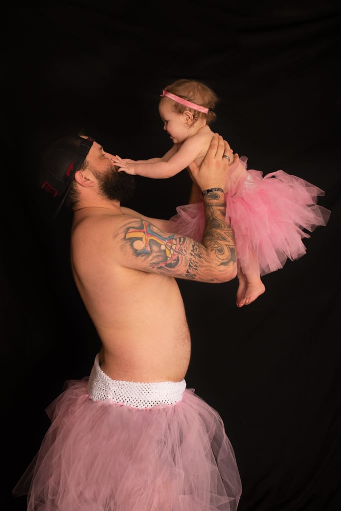Dad and Baby Daughter Wear Matching Tutus For Photo Shoot